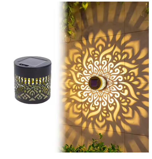 Lámpara solar mandala proyectando en muro